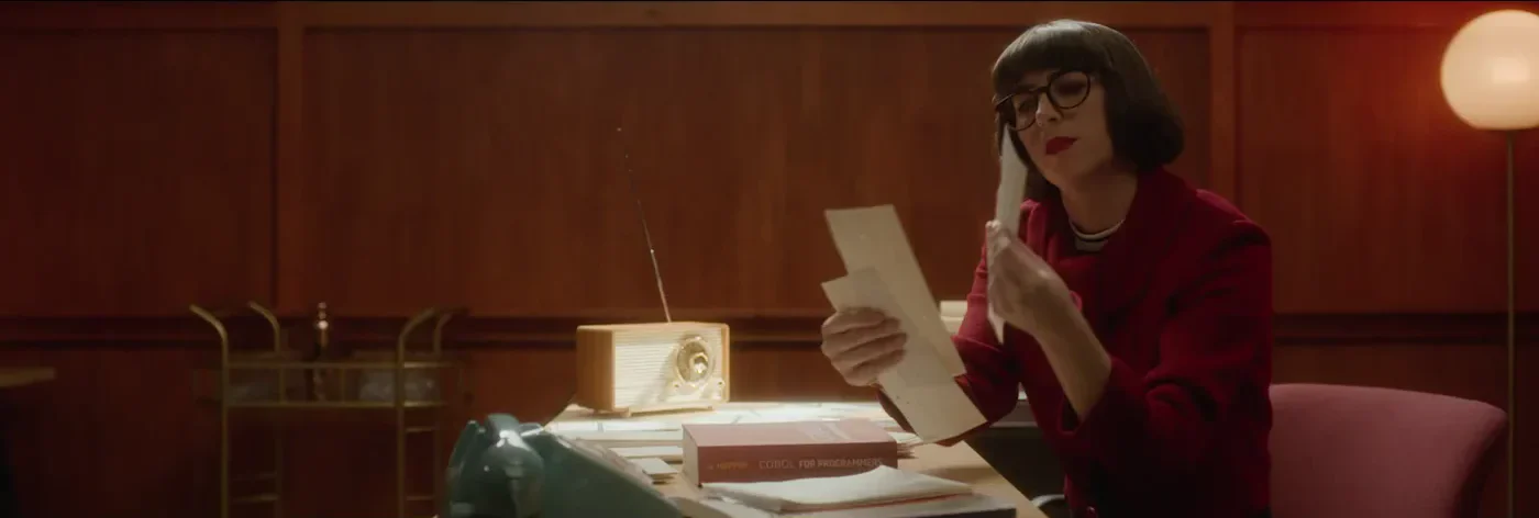1960s — the plate: the secretary at her desk, before the punch-card machine