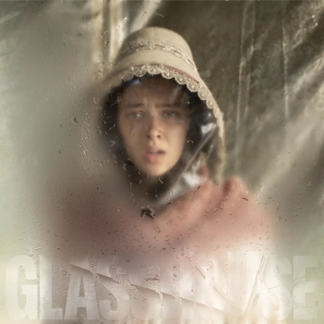 Glasshouse title fading in over a woman in a lace bonnet behind fogged glass