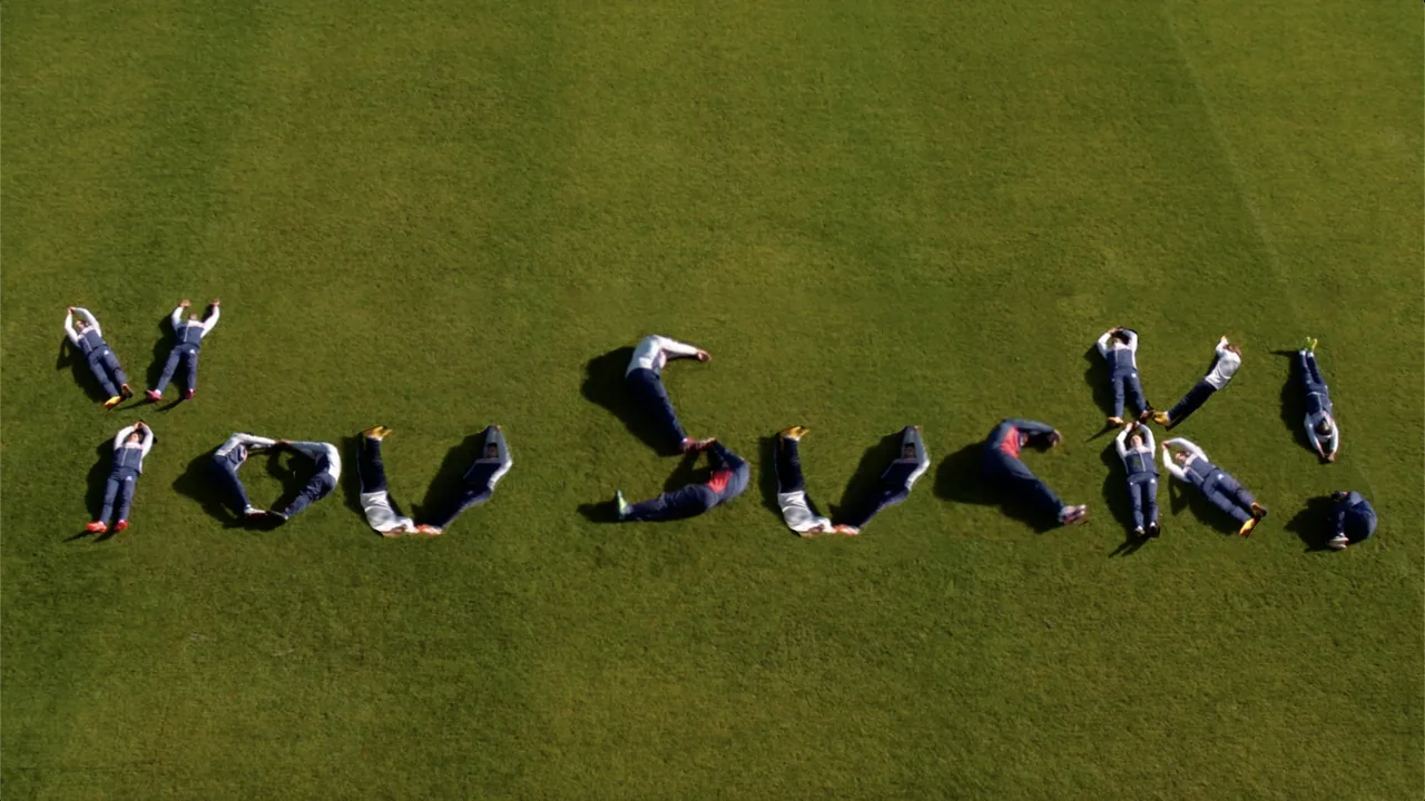 Players spelling out You Suck on the pitch